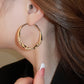 Boucles d'oreilles circulaires avec zircon