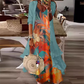 🌊 Tenue complète bohème fluide, robe longue motif artistique et kimono léger parfait pour les vacances✨ 🤍 Tenue de vacances deux‑pièces, tissu aéré, look décontracté et charmant